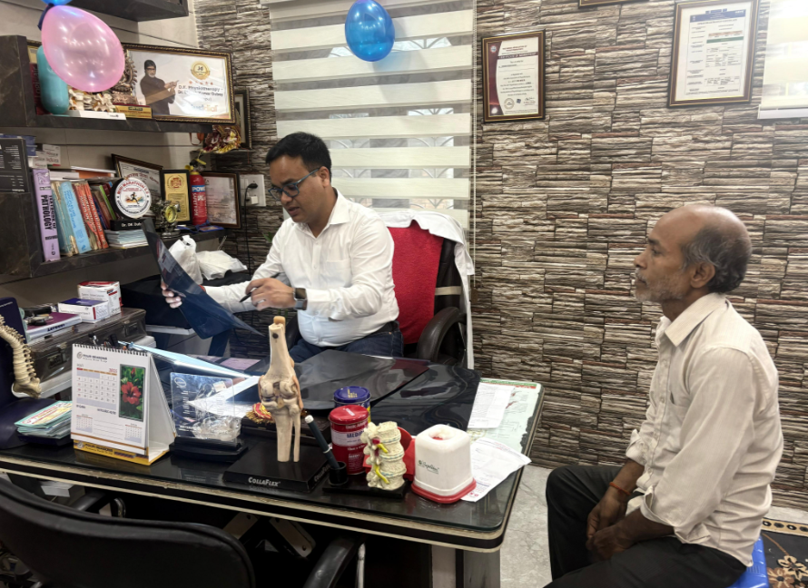 Patient consultation with X-ray review